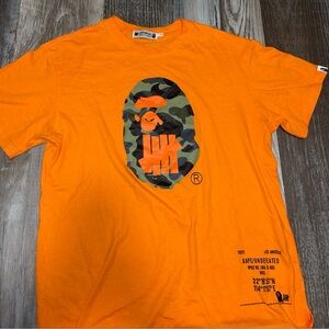 Men’s Bape shirt. Size large. Fits like a medium. Preowned. Like Brand new